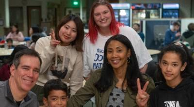 An image of students with their host family